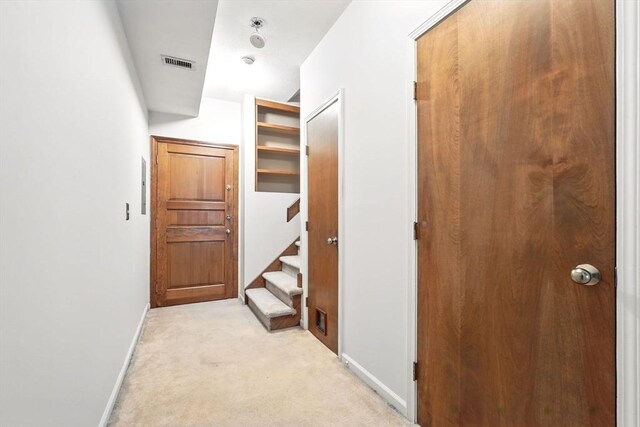 124 College St Unit 20, South Hadley, MA 01075 - hallway with baseboards, light carpet, and stairway