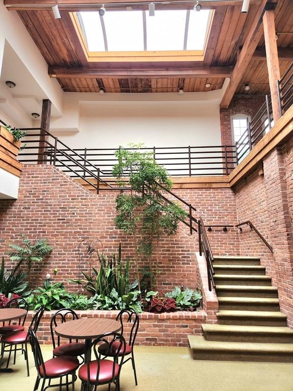 124 College St Unit 20, South Hadley, MA 01075 - view of patio with outdoor dining area and stairs