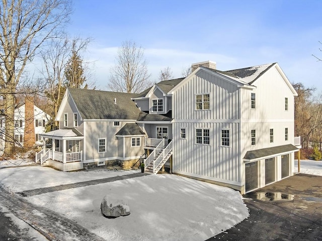 back of property featuring a garage