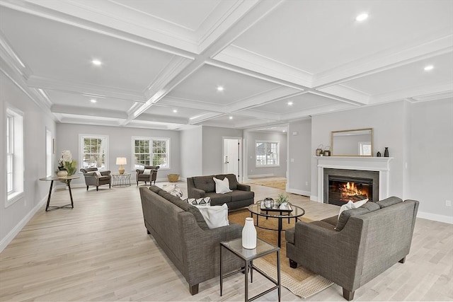 living room with beamed ceiling, ornamental molding, light hardwood / wood-style flooring, and coffered ceiling