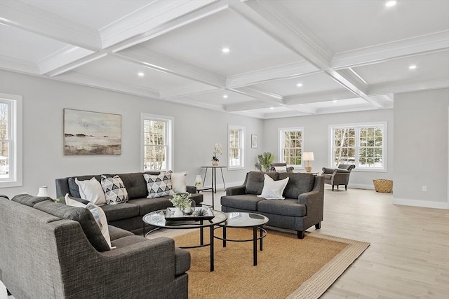 living room with beam ceiling, light hardwood / wood-style floors, a wealth of natural light, and coffered ceiling