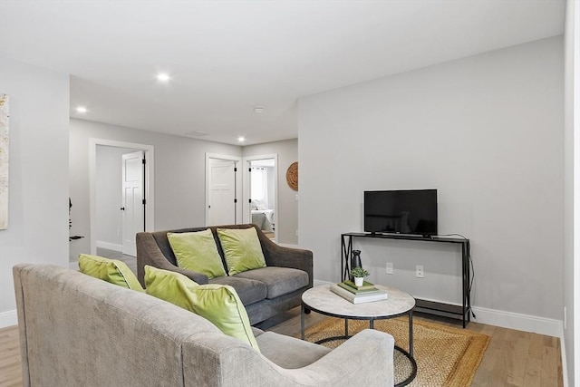 living room with light hardwood / wood-style flooring