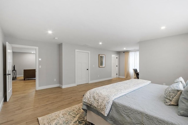 bedroom with light hardwood / wood-style floors