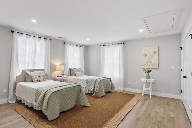 bedroom with light hardwood / wood-style flooring