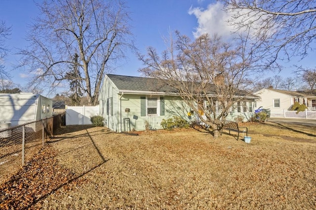 back of house with a yard