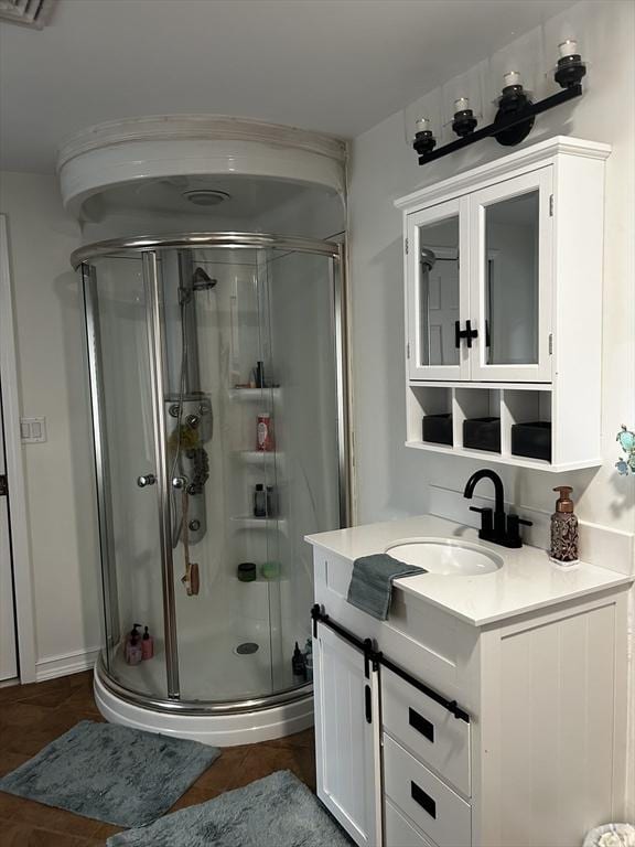 bathroom with a stall shower and vanity