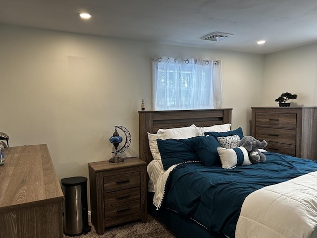 bedroom featuring visible vents, dark colored carpet, and recessed lighting