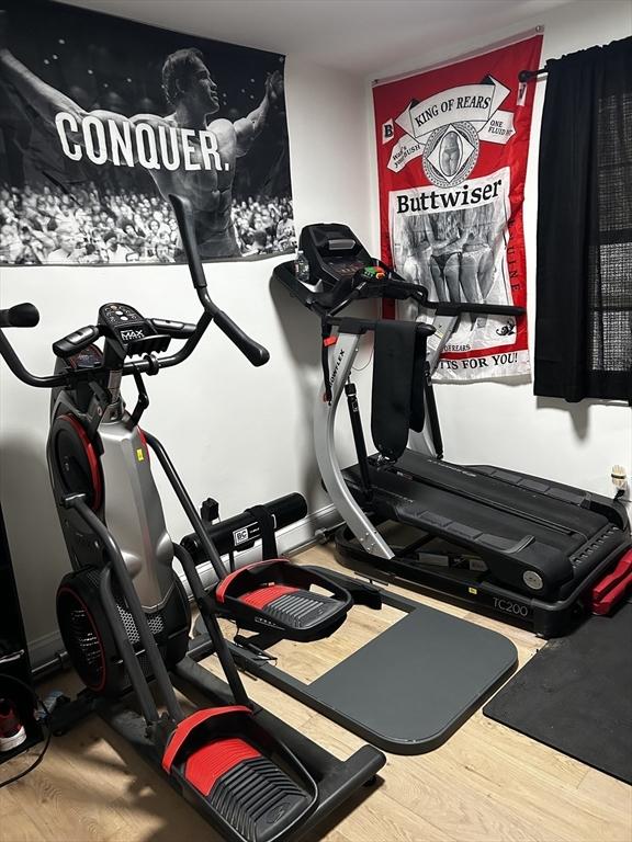 workout area featuring wood finished floors