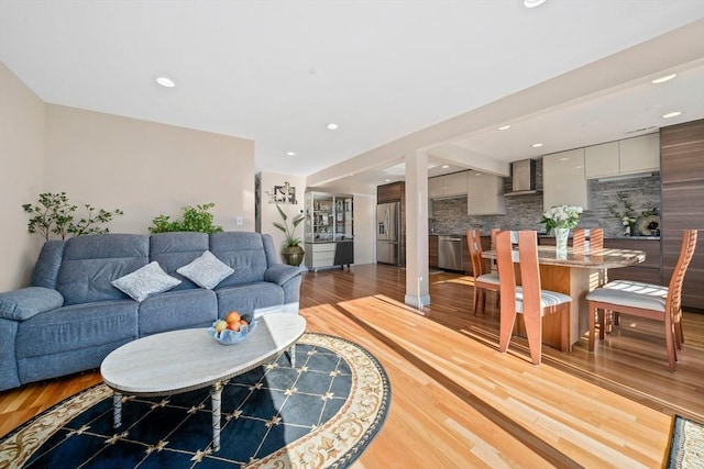 living room with light hardwood / wood-style flooring