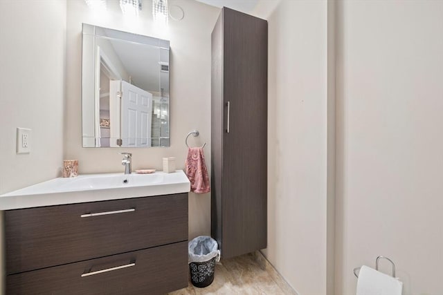 bathroom with hardwood / wood-style floors and vanity