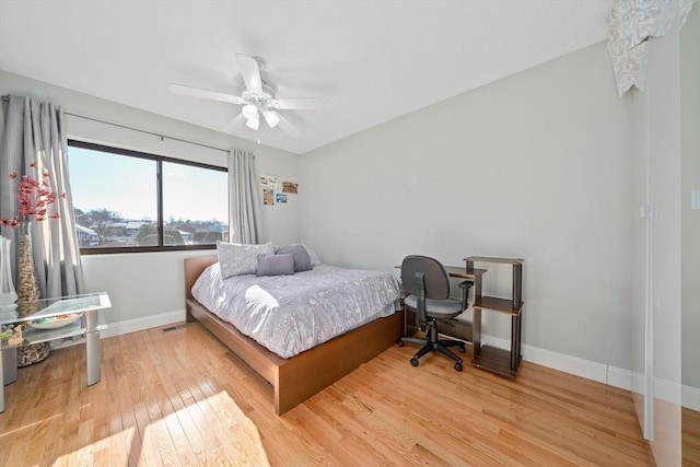 bedroom with light hardwood / wood-style flooring and ceiling fan