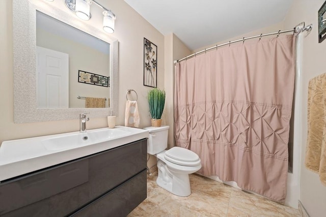 full bathroom with vanity, toilet, and shower / tub combo with curtain