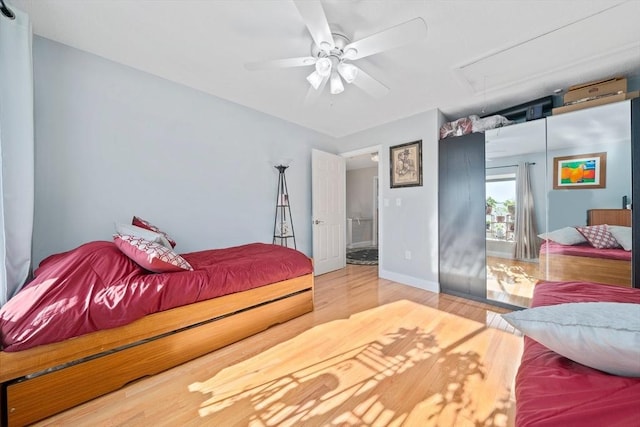 bedroom with hardwood / wood-style floors and ceiling fan