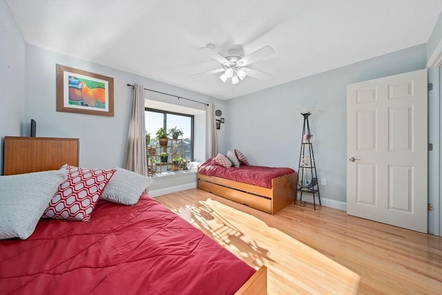 bedroom featuring ceiling fan and hardwood / wood-style floors