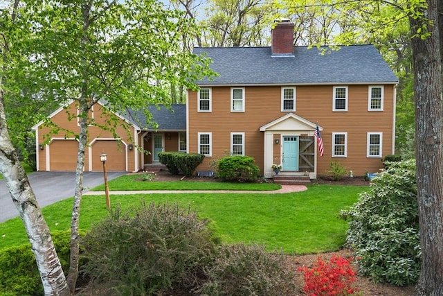 6 Shannon Cir, Westford, MA 01886 - colonial inspired home with a chimney, a front yard, roof with shingles, asphalt driveway, and a garage