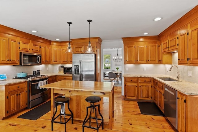 6 Shannon Cir, Westford, MA 01886 - kitchen featuring stainless steel appliances, a sink, backsplash, light wood-style floors, and recessed lighting