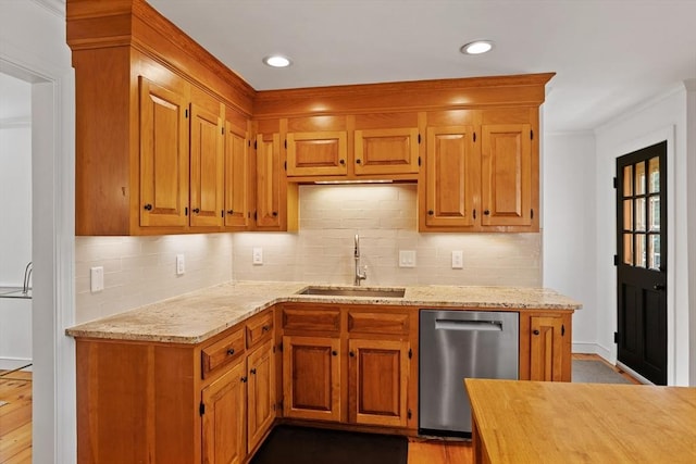 6 Shannon Cir, Westford, MA 01886 - kitchen featuring stainless steel dishwasher, a sink, light stone countertops, decorative backsplash, and crown molding