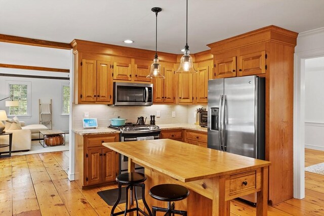 6 Shannon Cir, Westford, MA 01886 - kitchen featuring appliances with stainless steel finishes, light wood-type flooring, backsplash, butcher block counters, and pendant lighting