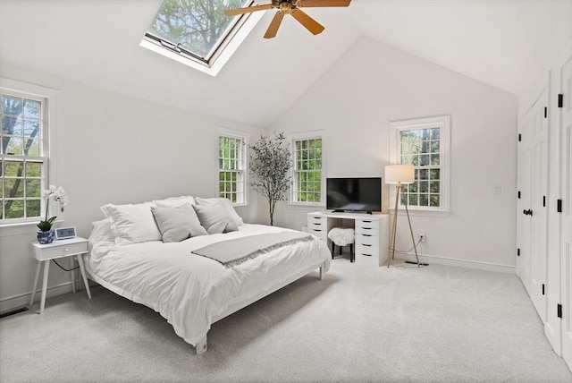6 Shannon Cir, Westford, MA 01886 - carpeted bedroom with a skylight, baseboards, ceiling fan, and high vaulted ceiling