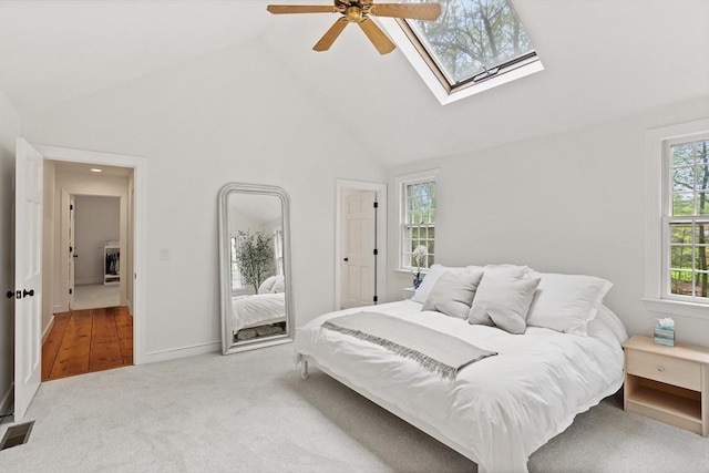 6 Shannon Cir, Westford, MA 01886 - carpeted bedroom featuring high vaulted ceiling, a skylight, and a ceiling fan