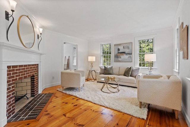 6 Shannon Cir, Westford, MA 01886 - living room with hardwood / wood-style flooring, ornamental molding, a brick fireplace, and baseboards