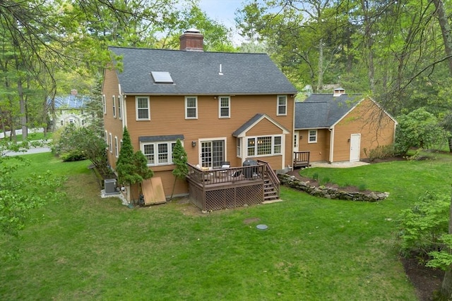 6 Shannon Cir, Westford, MA 01886 - rear view of house featuring a deck, a lawn, roof with shingles, and a chimney