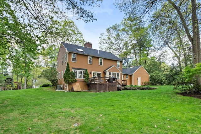 6 Shannon Cir, Westford, MA 01886 - rear view of property featuring a deck, a chimney, central AC, and a yard