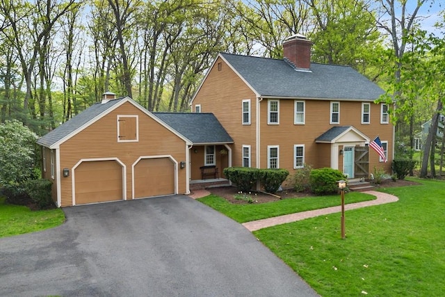 6 Shannon Cir, Westford, MA 01886 - colonial inspired home featuring a chimney, a front lawn, driveway, a garage, and a shingled roof