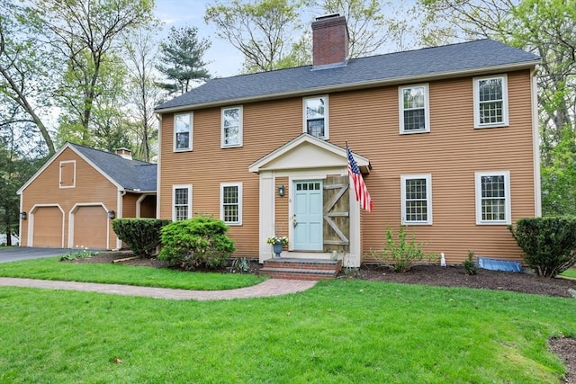 6 Shannon Cir, Westford, MA 01886 - colonial-style house featuring a chimney, a front lawn, driveway, and an attached garage