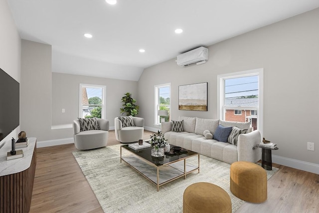 36-38 Madison St, Weymouth, MA 02189 - living area with an AC wall unit, light wood-type flooring, recessed lighting, and vaulted ceiling