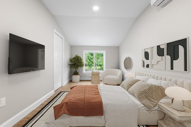 36-38 Madison St, Weymouth, MA 02189 - bedroom with lofted ceiling, wood finished floors, and a wall unit AC