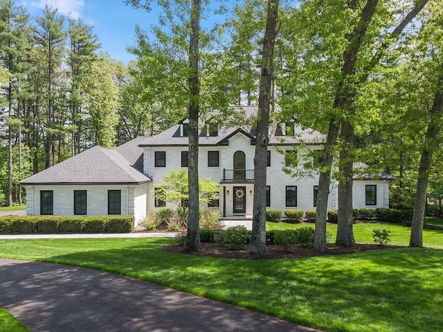 31 Alford Cir, Concord, MA 01742 - view of front of home featuring a balcony and a front yard
