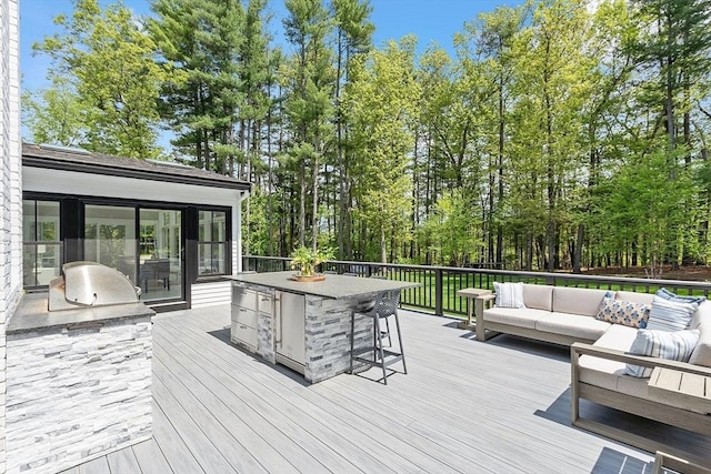 31 Alford Cir, Concord, MA 01742 - wooden deck with area for grilling, outdoor lounge area, and a grill