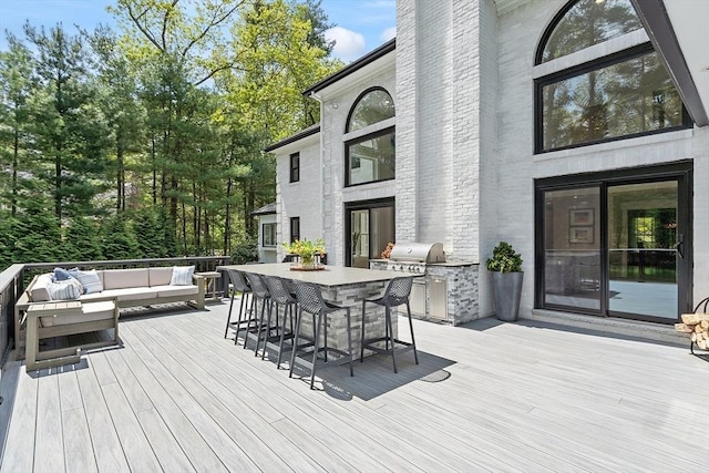 31 Alford Cir, Concord, MA 01742 - deck with an outdoor living space and exterior kitchen
