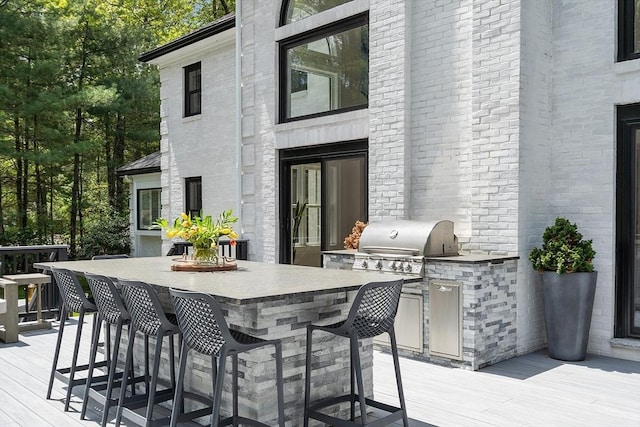 31 Alford Cir, Concord, MA 01742 - view of patio / terrace featuring a wooden deck and an outdoor kitchen