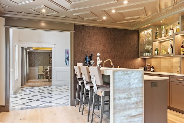 31 Alford Cir, Concord, MA 01742 - indoor wet bar featuring inlaid floor details, recessed lighting, and a wainscoted wall
