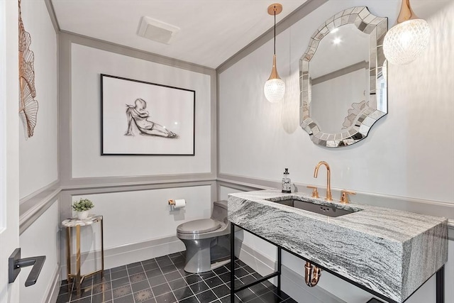 31 Alford Cir, Concord, MA 01742 - bathroom with a sink, toilet, and tile patterned flooring