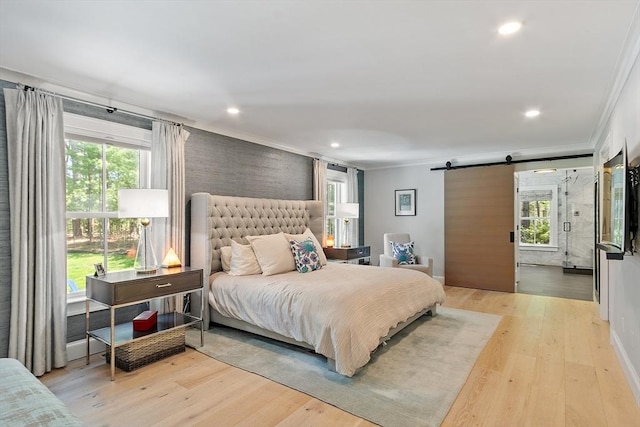 31 Alford Cir, Concord, MA 01742 - bedroom with ornamental molding, a barn door, multiple windows, wood finished floors, and recessed lighting