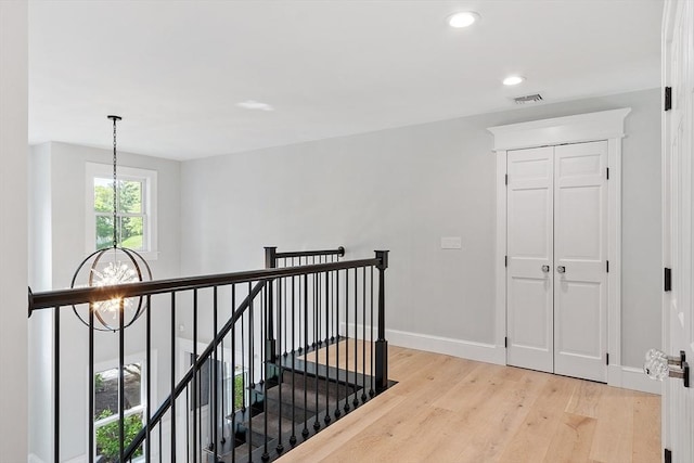 31 Alford Cir, Concord, MA 01742 - hall featuring a chandelier, an upstairs landing, light wood-type flooring, baseboards, and recessed lighting