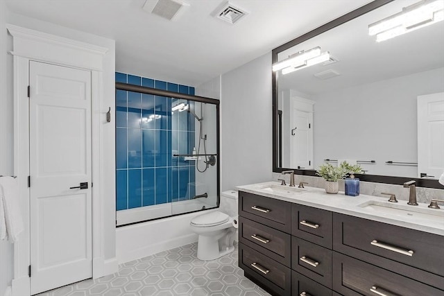 31 Alford Cir, Concord, MA 01742 - bathroom featuring enclosed tub / shower combo, double vanity, toilet, and tile patterned flooring