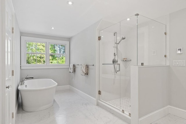 31 Alford Cir, Concord, MA 01742 - bathroom with marble finish floors, a stall shower, baseboards, a freestanding bath, and recessed lighting
