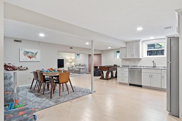 31 Alford Cir, Concord, MA 01742 - dining area featuring light wood finished floors, recessed lighting, and wet bar