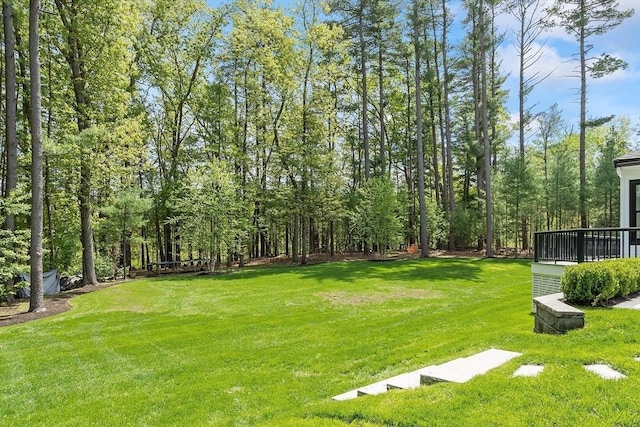 31 Alford Cir, Concord, MA 01742 - view of grassy yard featuring a deck