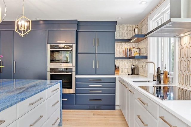 31 Alford Cir, Concord, MA 01742 - kitchen featuring a sink, black electric stovetop, wall chimney exhaust hood, double oven, and decorative backsplash