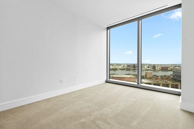 1 Dalton St Unit 3302, Boston, MA 02199 - spare room featuring a wall of windows, carpet flooring, healthy amount of natural light, and baseboards