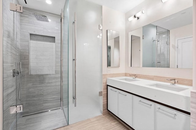 1 Dalton St Unit 3302, Boston, MA 02199 - bathroom featuring a stall shower, double vanity, and wood finished floors
