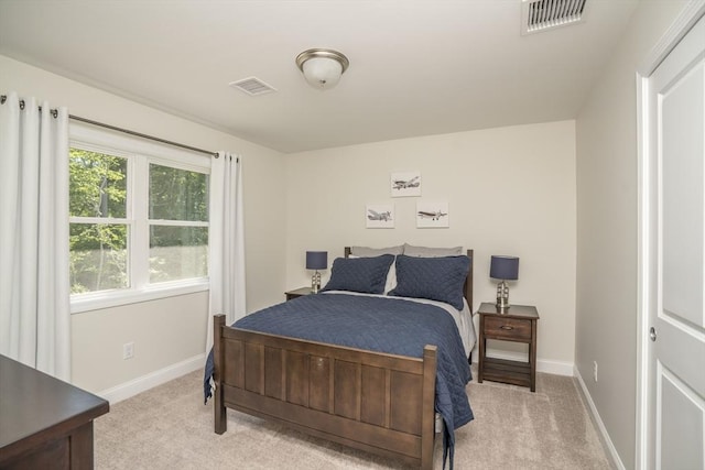 bedroom with light carpet