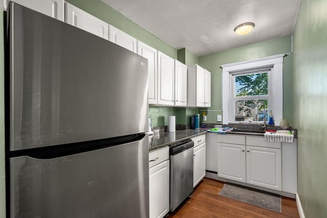 14 Forest Ave, Salem, MA 01970 - kitchen with appliances with stainless steel finishes, a sink, and white cabinets