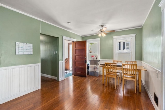14 Forest Ave, Salem, MA 01970 - dining space featuring wood-type flooring, a ceiling fan, crown molding, and a wainscoted wall