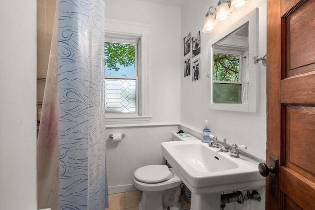 14 Forest Ave, Salem, MA 01970 - full bathroom with healthy amount of natural light, a wainscoted wall, toilet, a shower with curtain, and tile patterned flooring